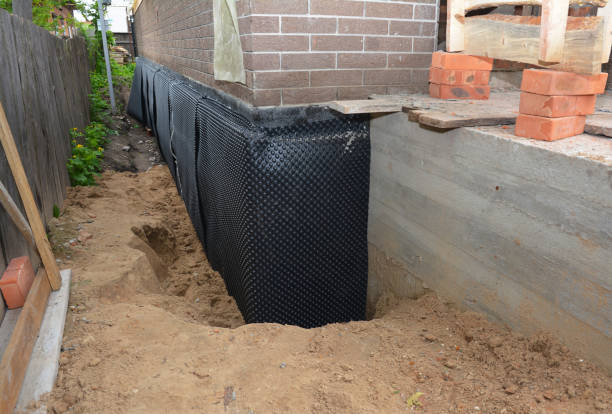 SJ Waterproofing Pros technician performing targeted Exterior Waterproofing assessment in Brookfield, WI